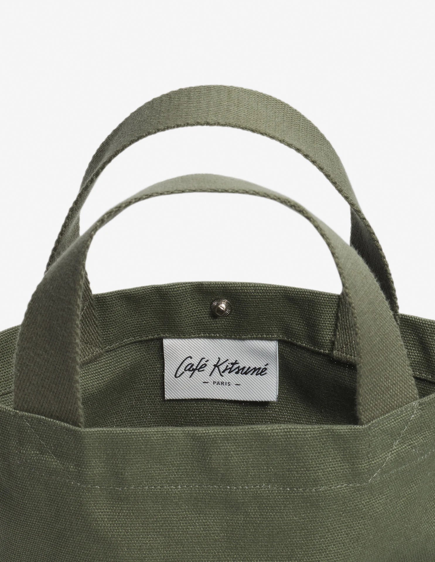Intérieur du sac tote Café Kitsuné avec étiquette de marque