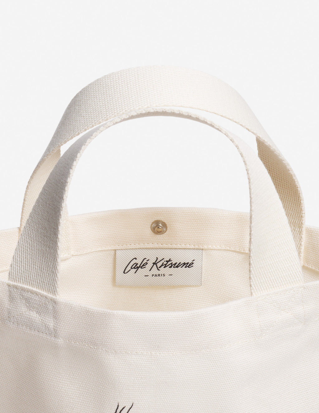 Intérieur du sac tote Café Kitsuné avec étiquette de marque