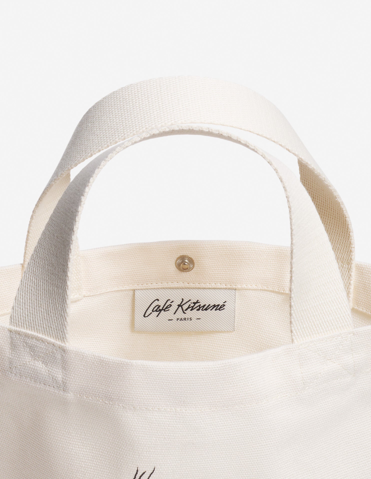 Intérieur du sac tote Café Kitsuné avec étiquette de marque