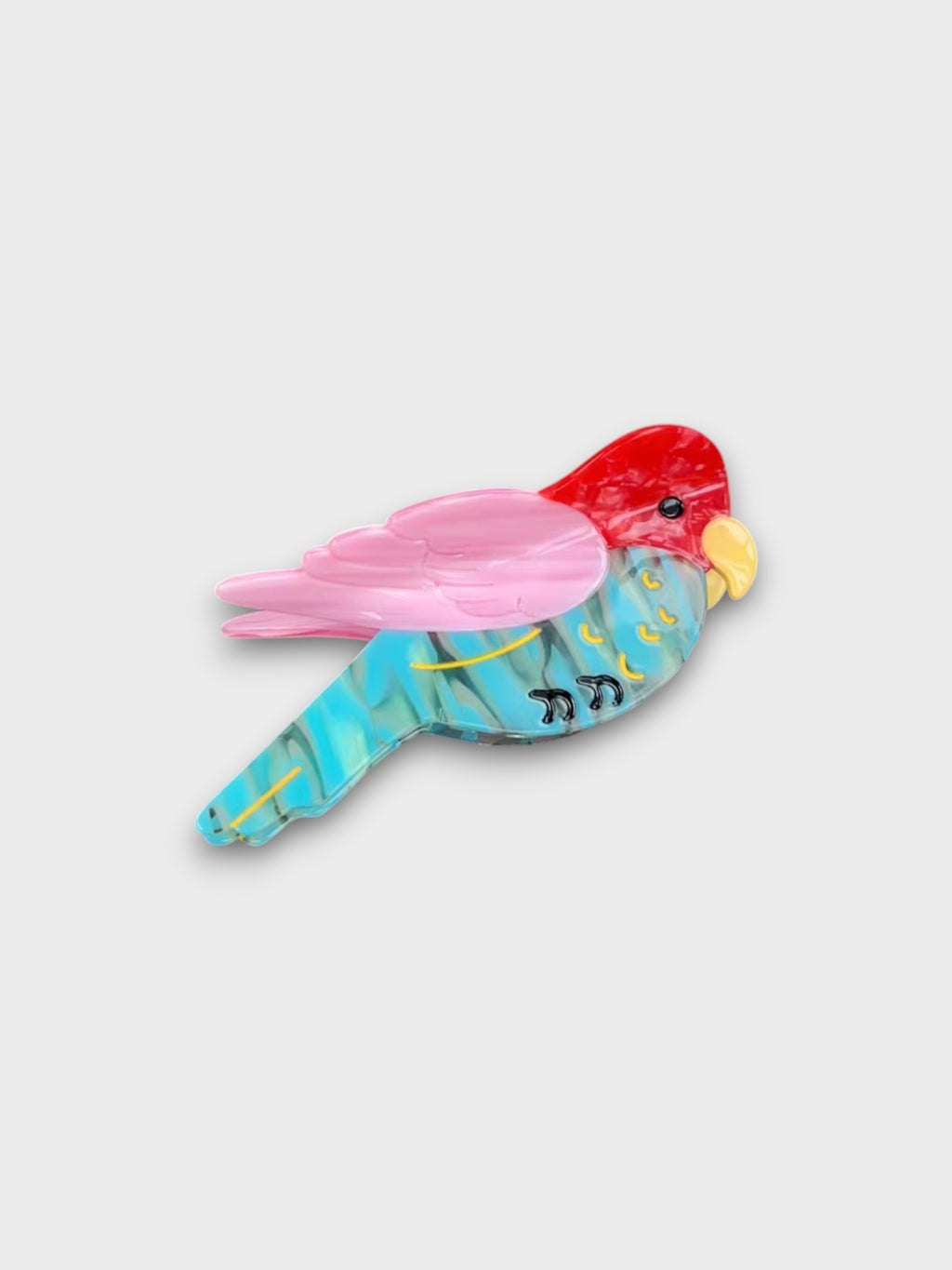 Barrette en résine DIOIB motif perroquet bleu, rose et rouge, photo produit sur fond blanc
