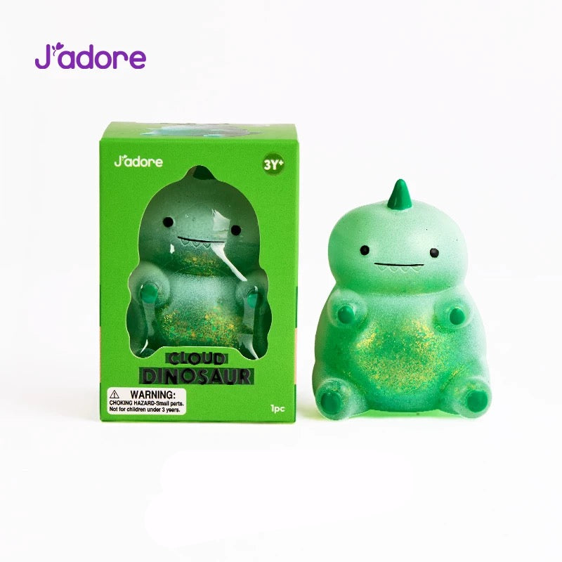 Figurine squishy J'adore Cloud Dinosaur vert pailleté avec sa boîte d'emballage, photo produit sur fond blanc
