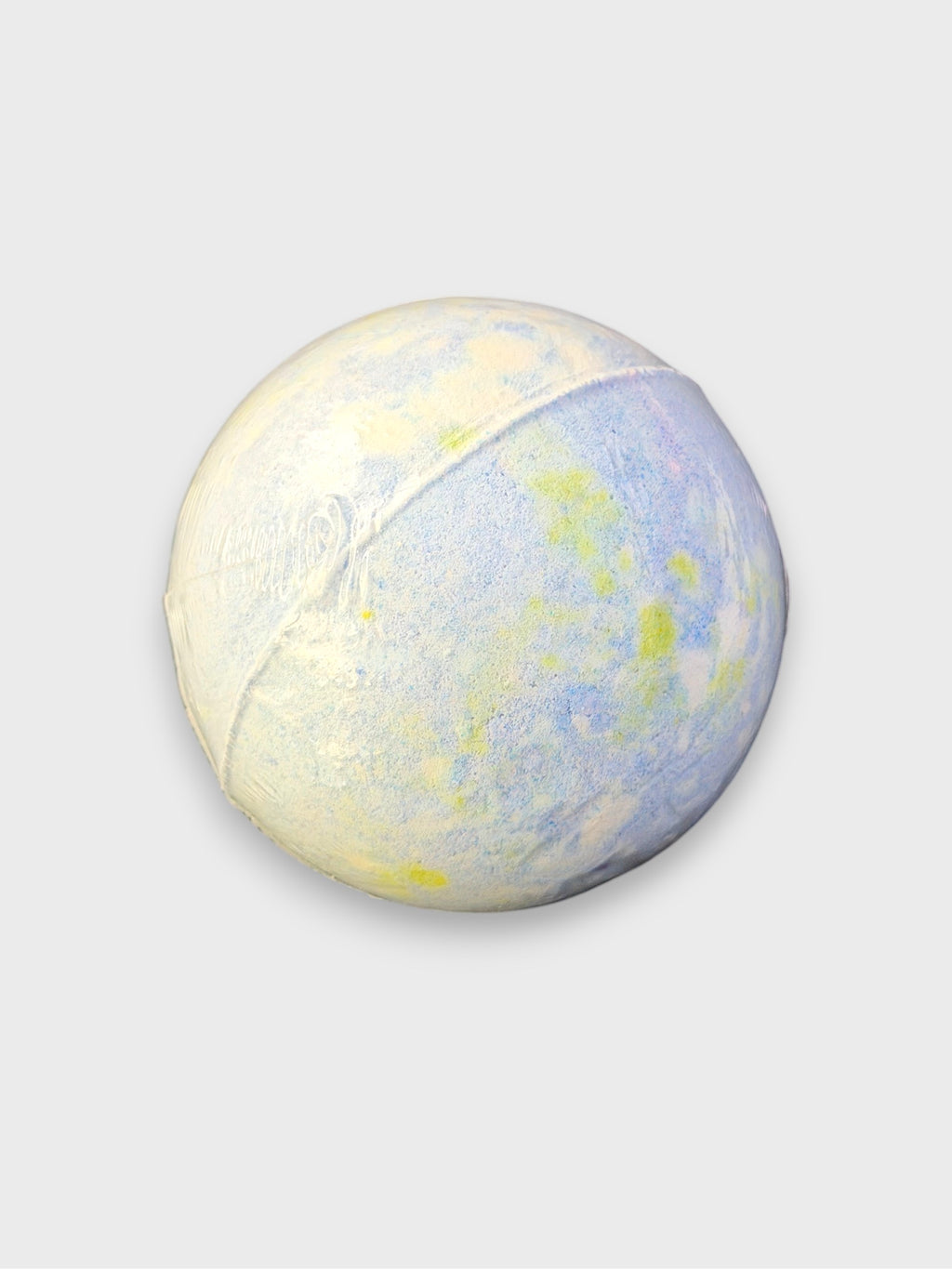 Bombe de bain artisanale bleue et jaune en bicarbonate, vue de dos