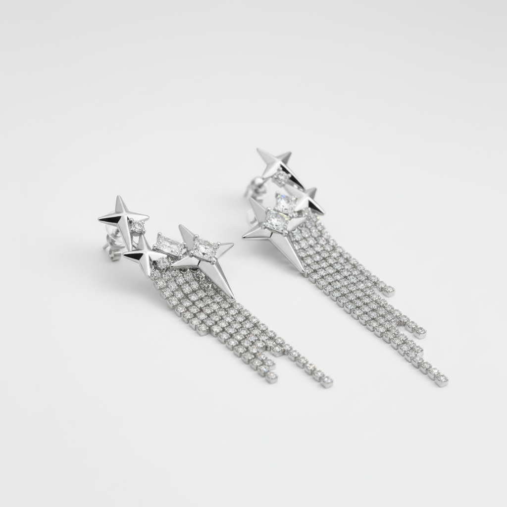 Boucles d'oreilles étoile franges FLV argentées métal et zircone, vue trois quarts fond blanc