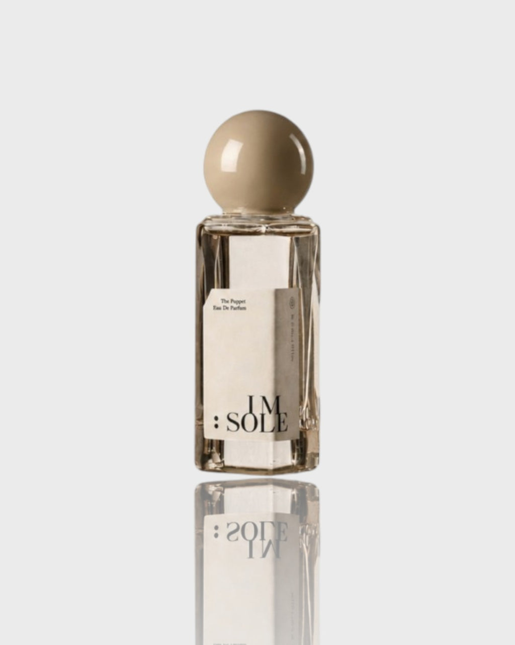 Eau de parfum flacon carré IMSOLE beige transparent en verre, vue de face