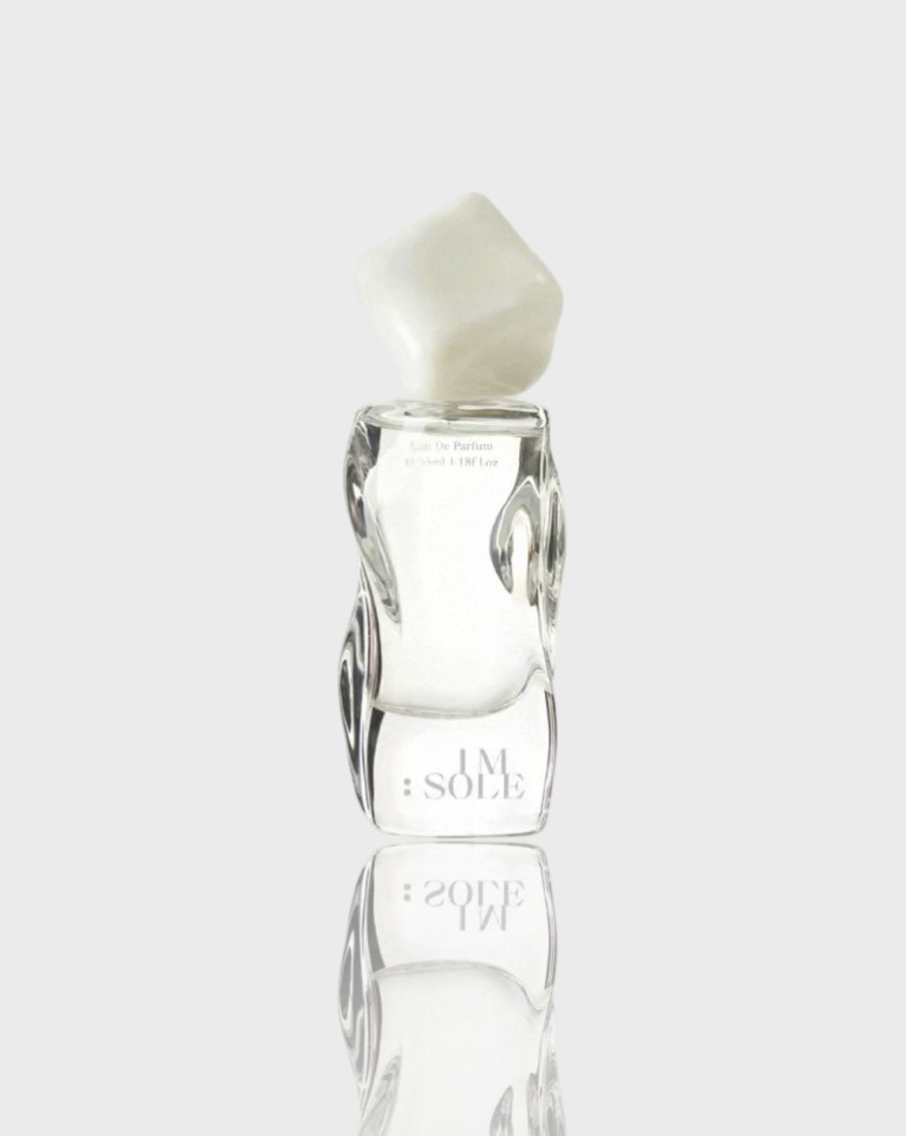 Eau de parfum verre sculpté IMSOLE blanc transparent en verre, vue de face